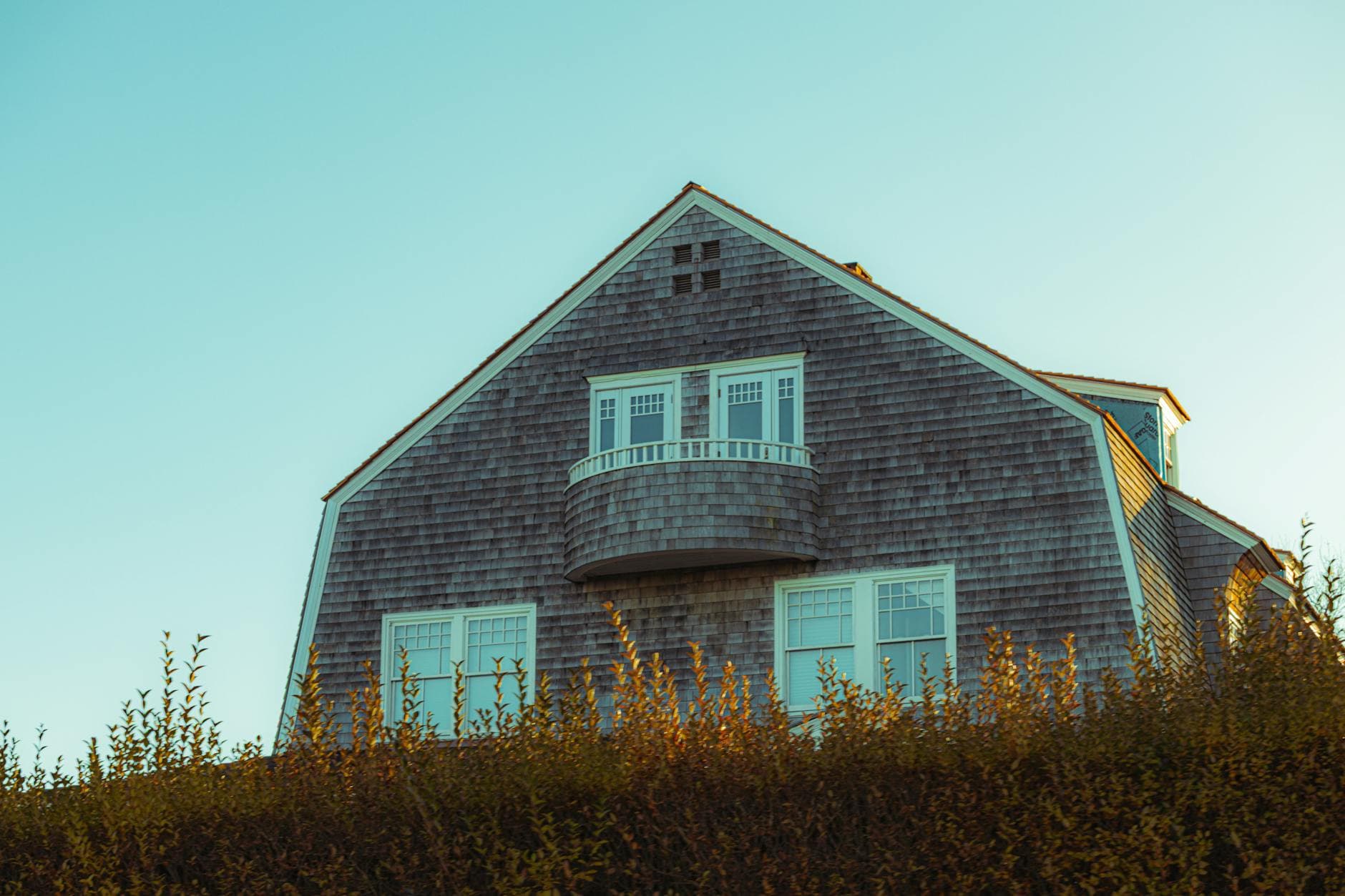Roofing crew installing architectural shingles on Kansas home