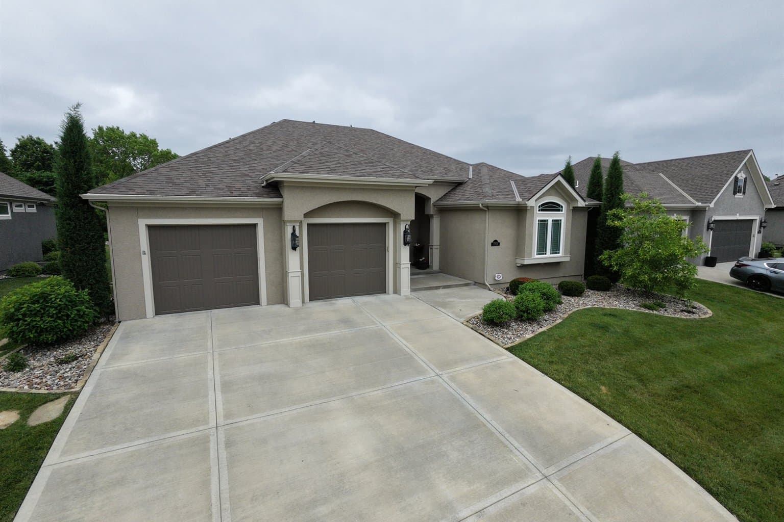 Aerial drone view of a completed asphalt shingle roof replacement on a Johnson County, Kansas home by MCO Roofing