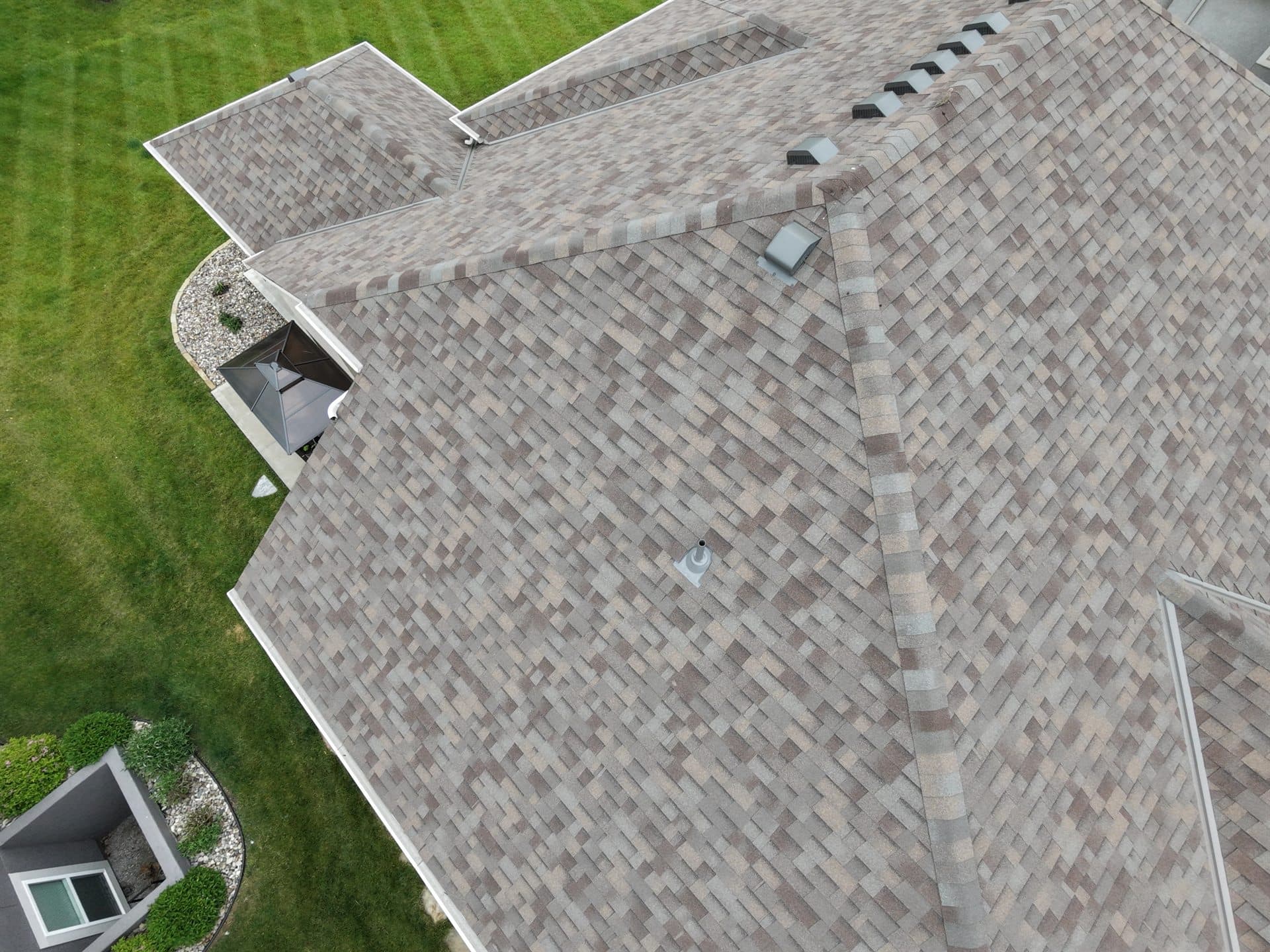 Drone view of a completed architectural shingle roof replacement in Johnson County, KS