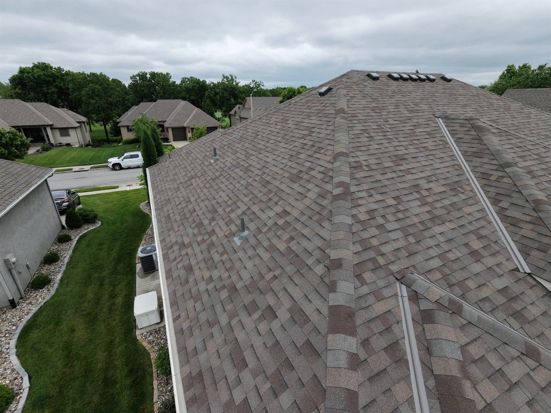 Drone view of a newly replaced roof on a suburban Kansas home