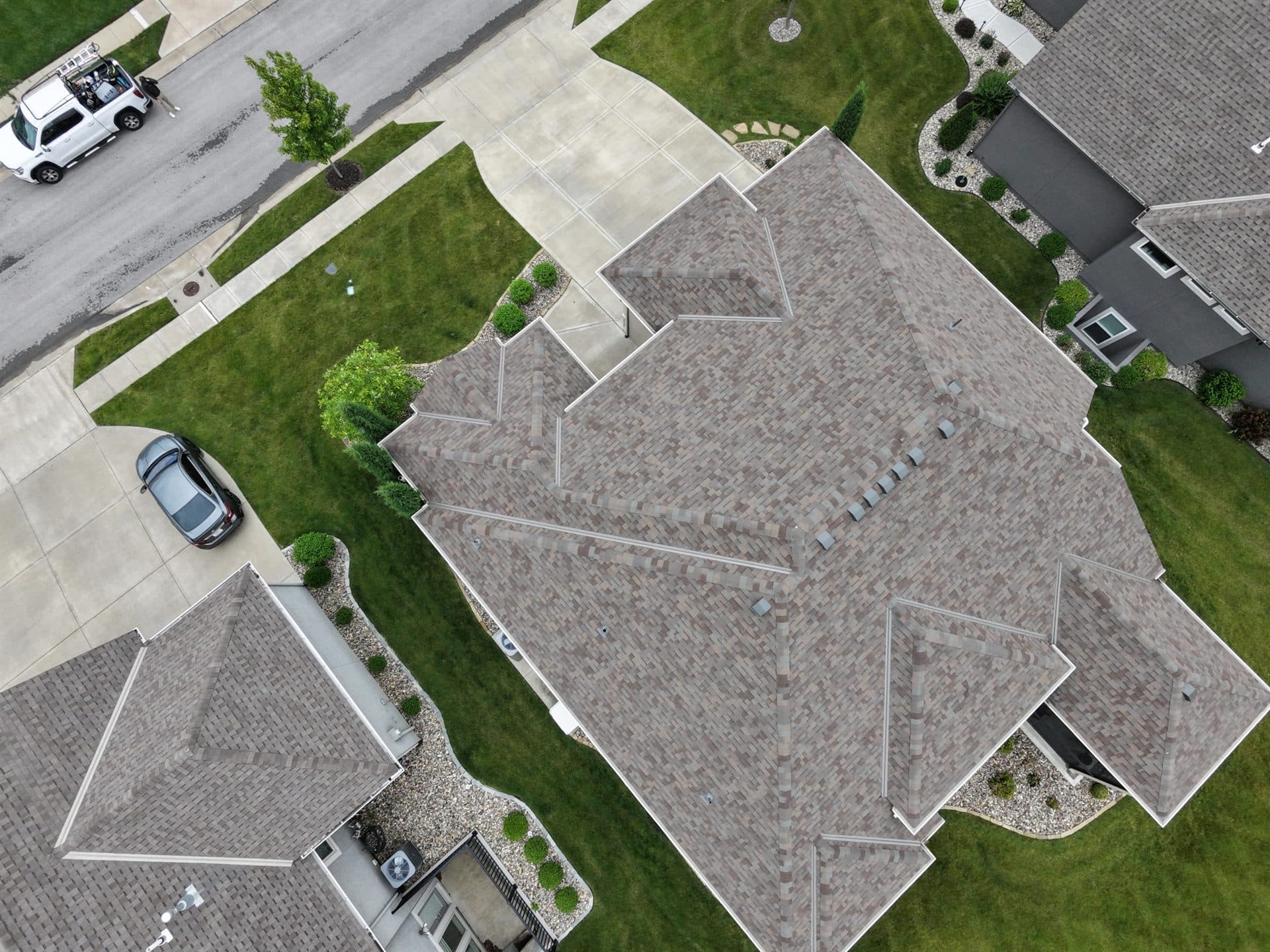 Overhead drone shot of a finished roof replacement in Kansas
