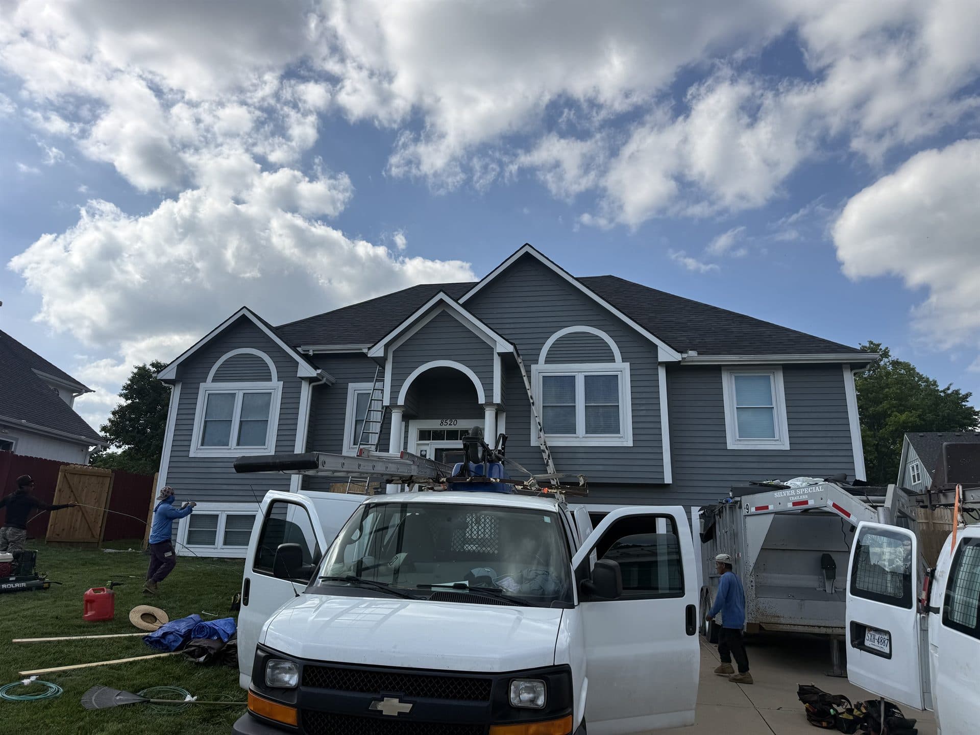 MCO Roofing service van on-site at a roof replacement in Johnson County, KS