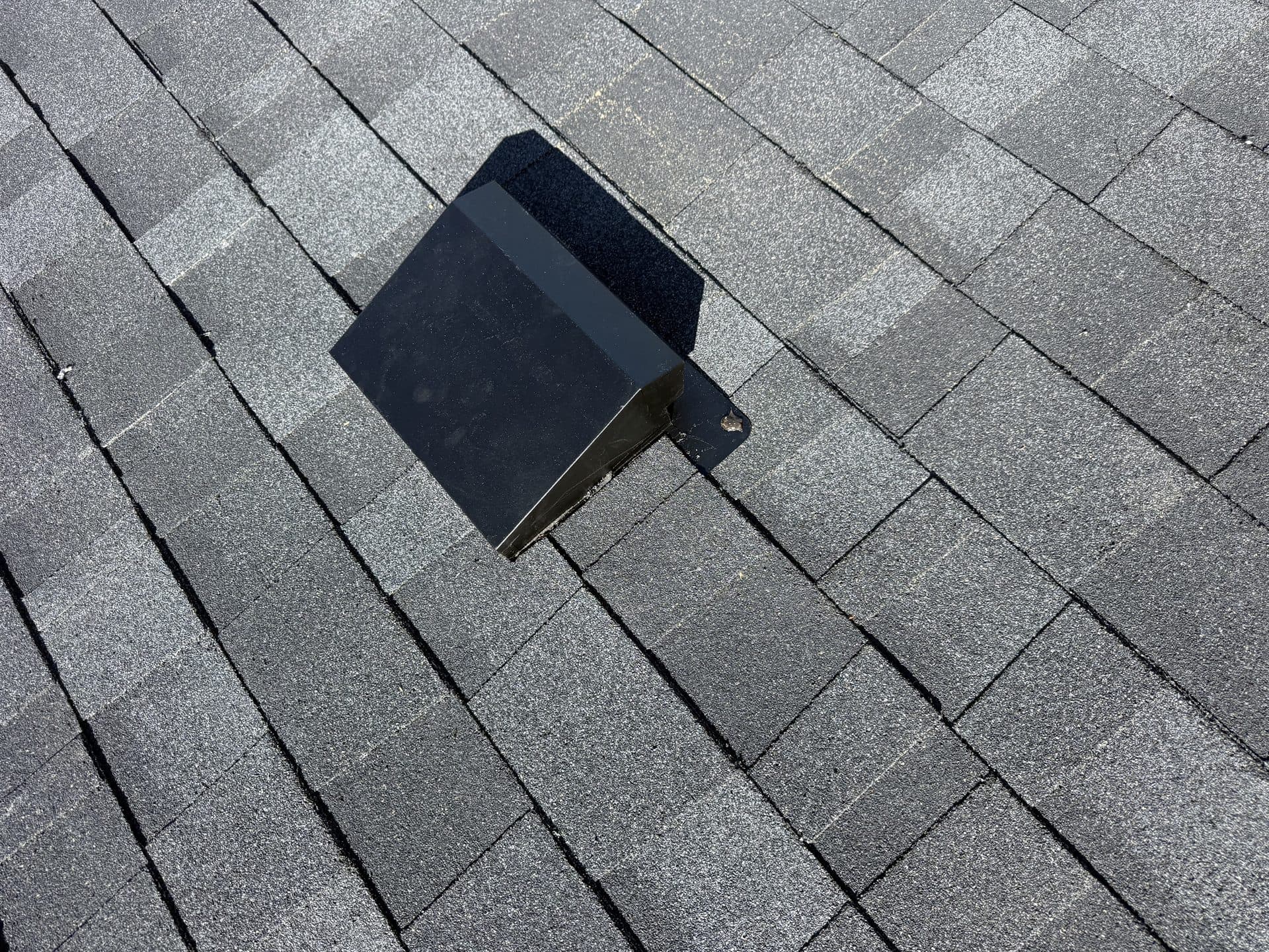 Close-up of a ridge vent on new architectural shingles in Johnson County, KS