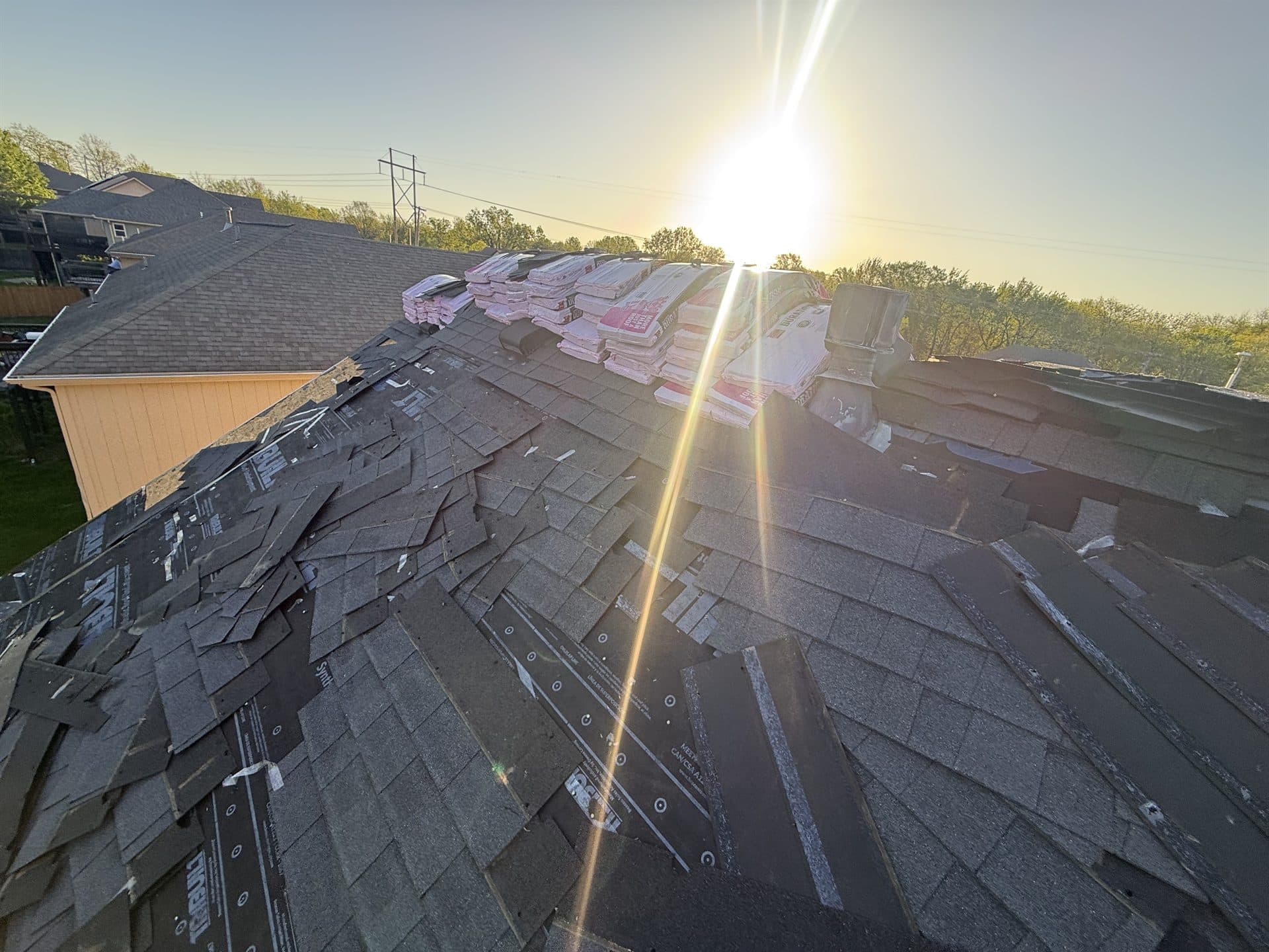 Completed shingle roof at sunset on a Johnson County, KS home