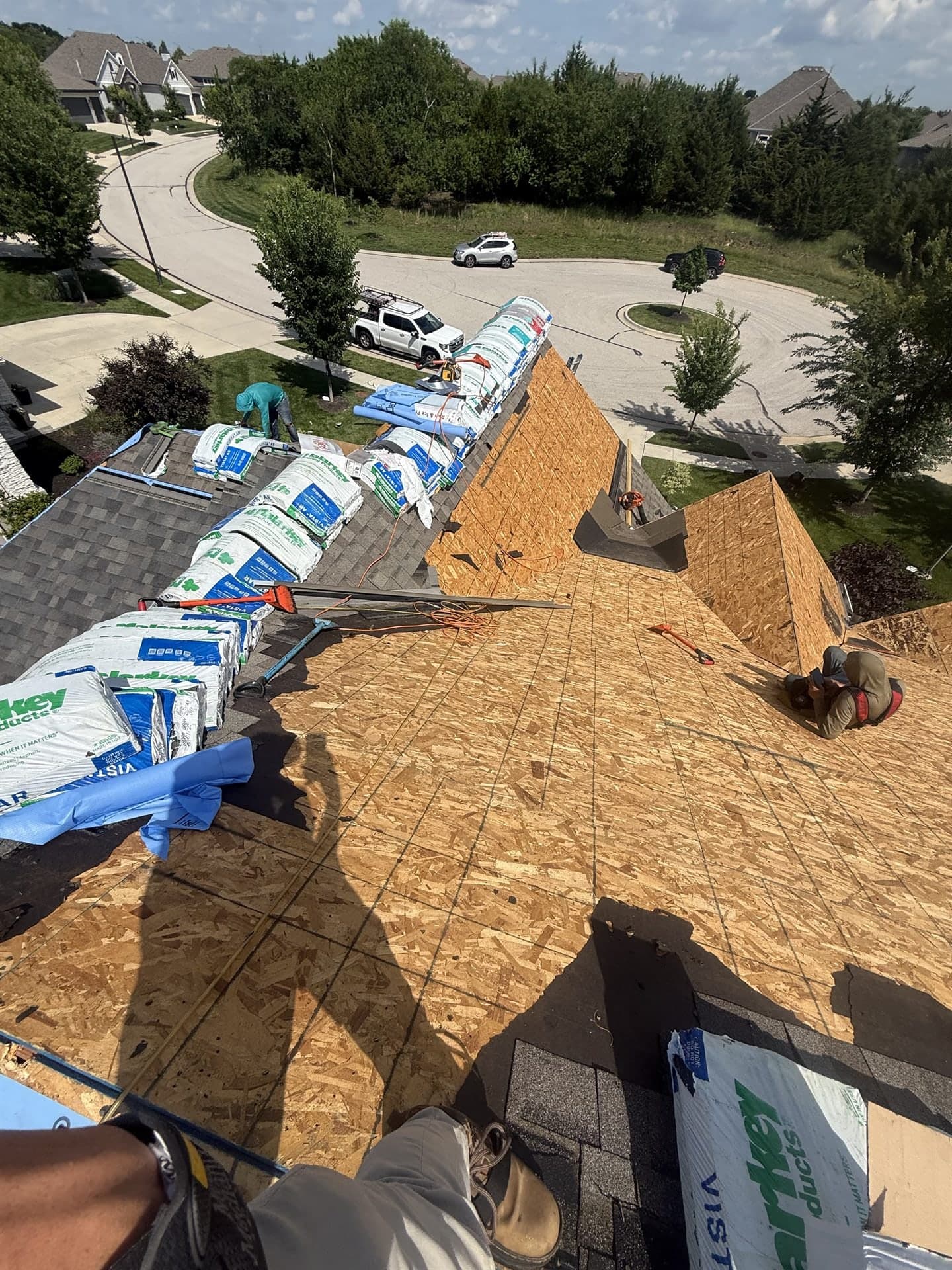 Old roof torn off to the decking before a new roof installation in Kansas