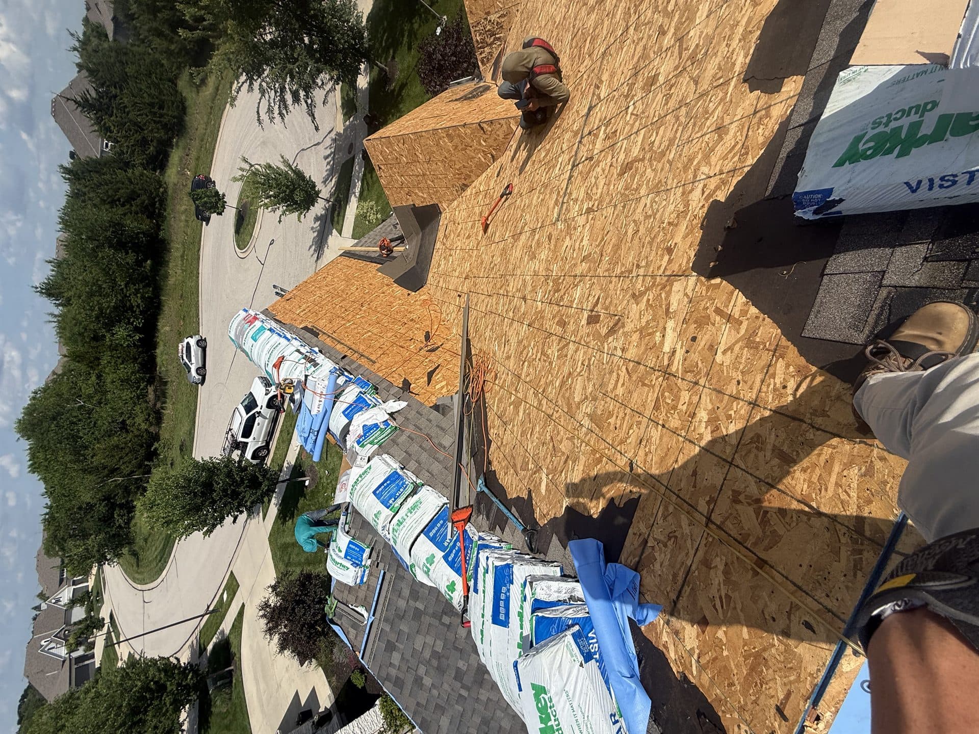 Old roof torn off to the decking before a new roof installation in Kansas