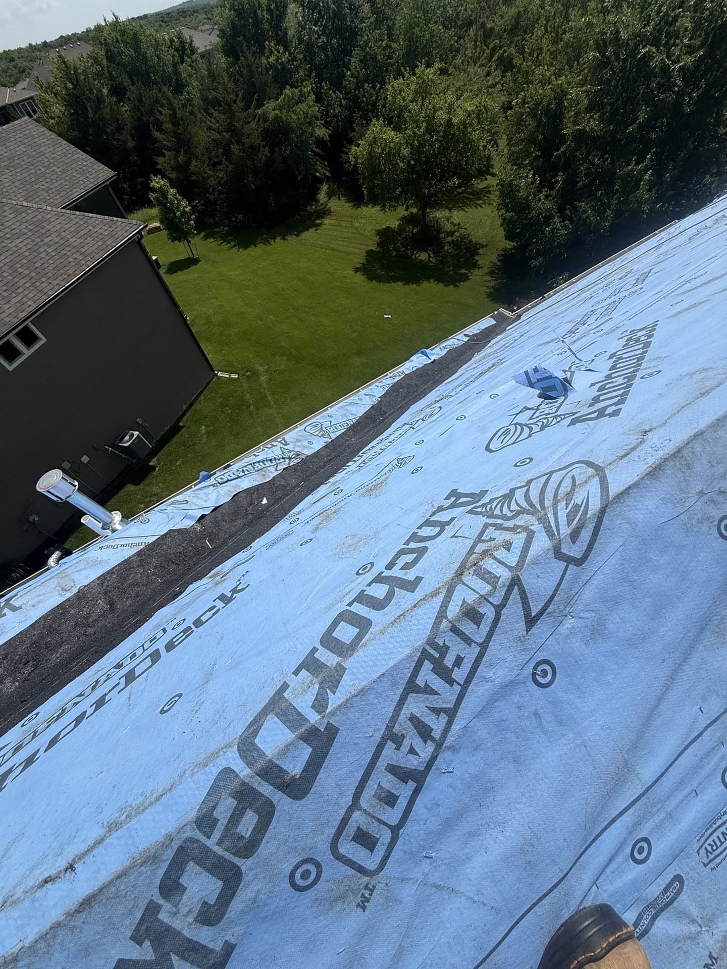 Synthetic underlayment installed on the roof deck before shingles in Johnson County, KS