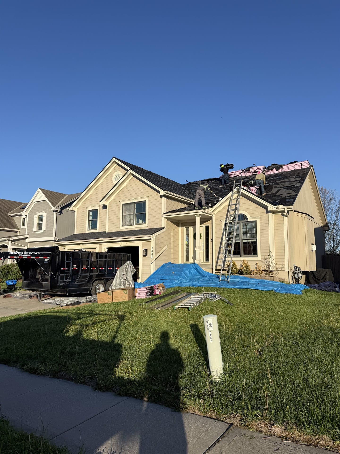 New residential roof replacement underway on a two-story Johnson County, KS home