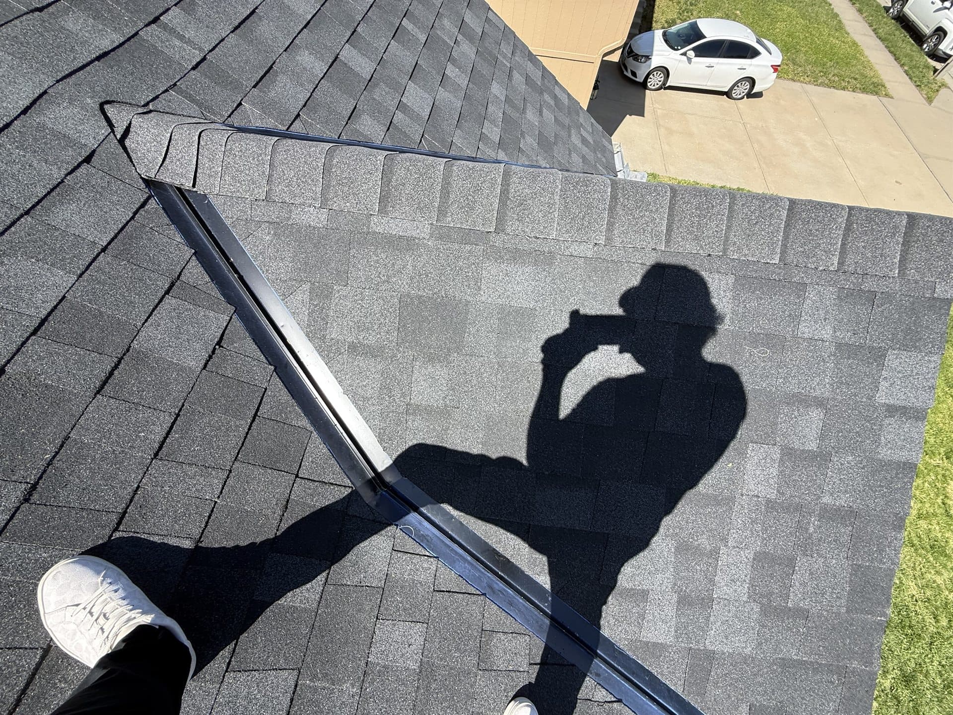 MCO Roofing contractor inspecting a residential roof in Johnson County, KS
