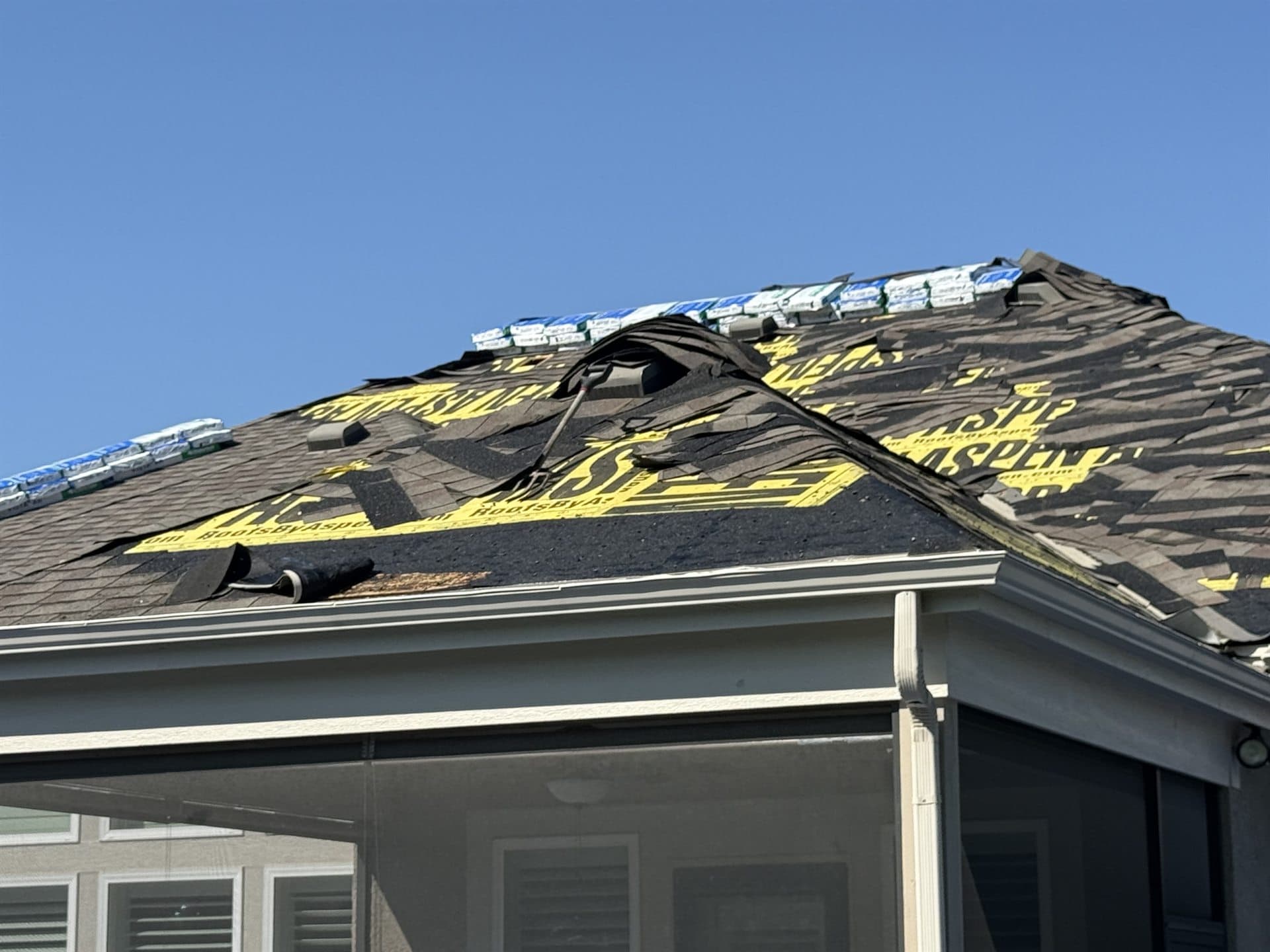 Close aerial of a residential roof during an MCO Roofing inspection in Johnson County, KS