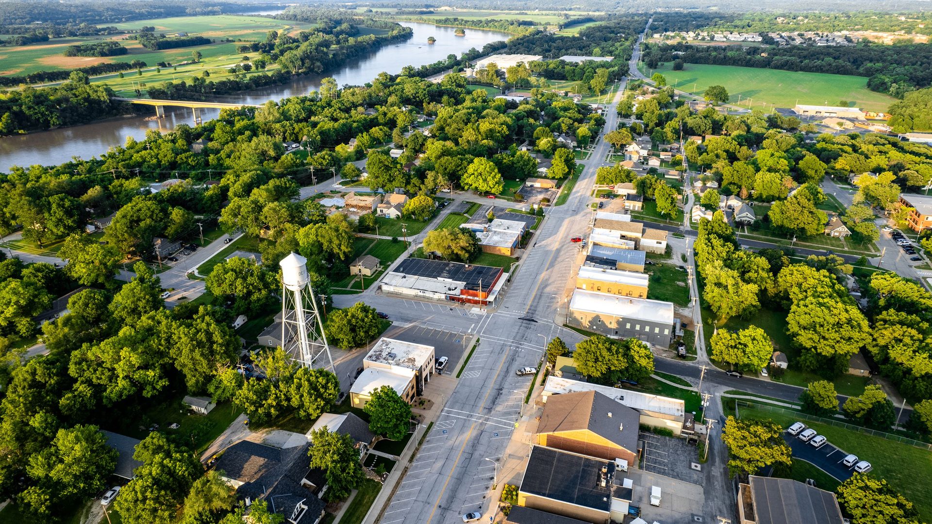 Aerial view of downtown De Soto and its water tower beside the Kansas River