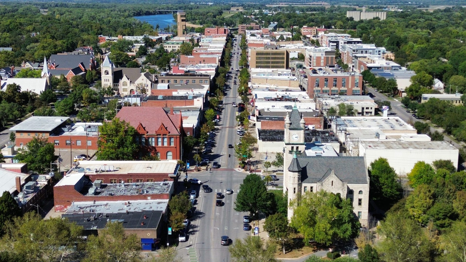 Aerial view north along Massachusetts Street in downtown Lawrence, past the Douglas County Courthouse toward the Kansas River