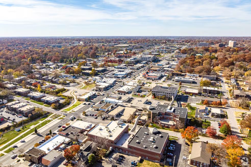 Aerial view of Roeland Park homes, businesses and autumn trees