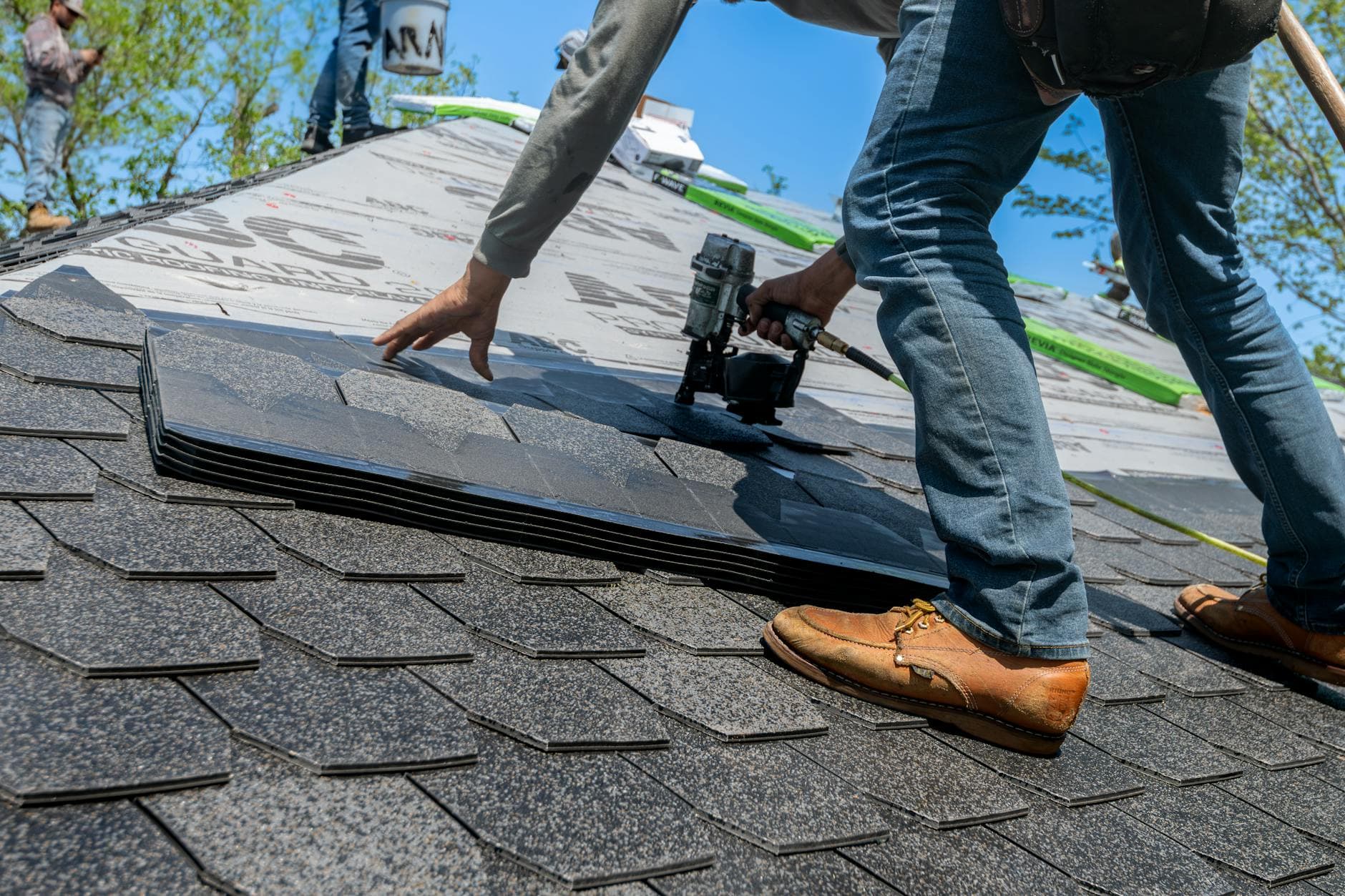 Impact-resistant Class 4 shingles being installed on a Kansas home