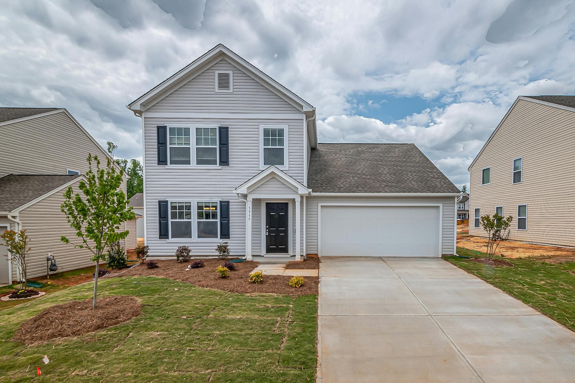 Residential neighborhood in Olathe Kansas with mixed roofing styles