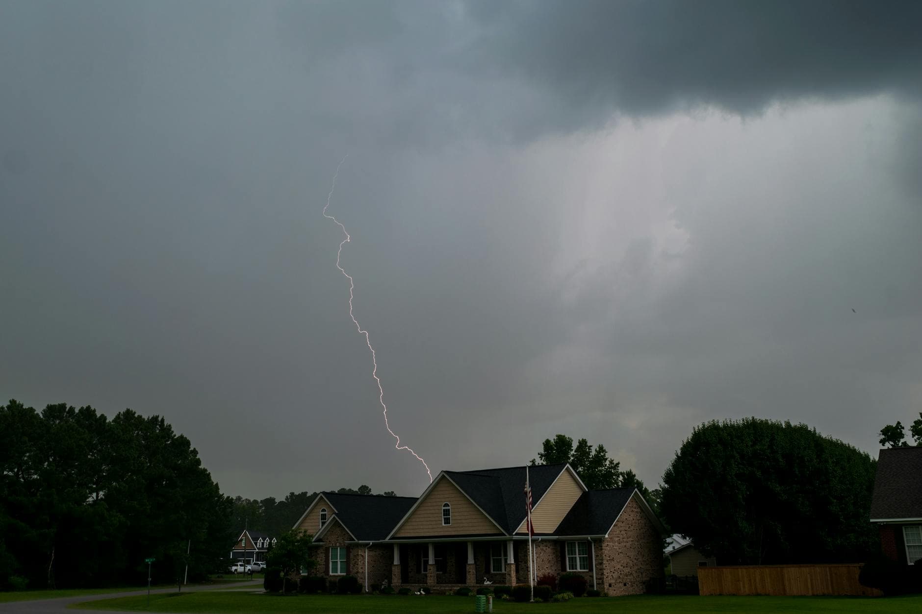 Dark storm clouds forming over a Kansas neighborhood