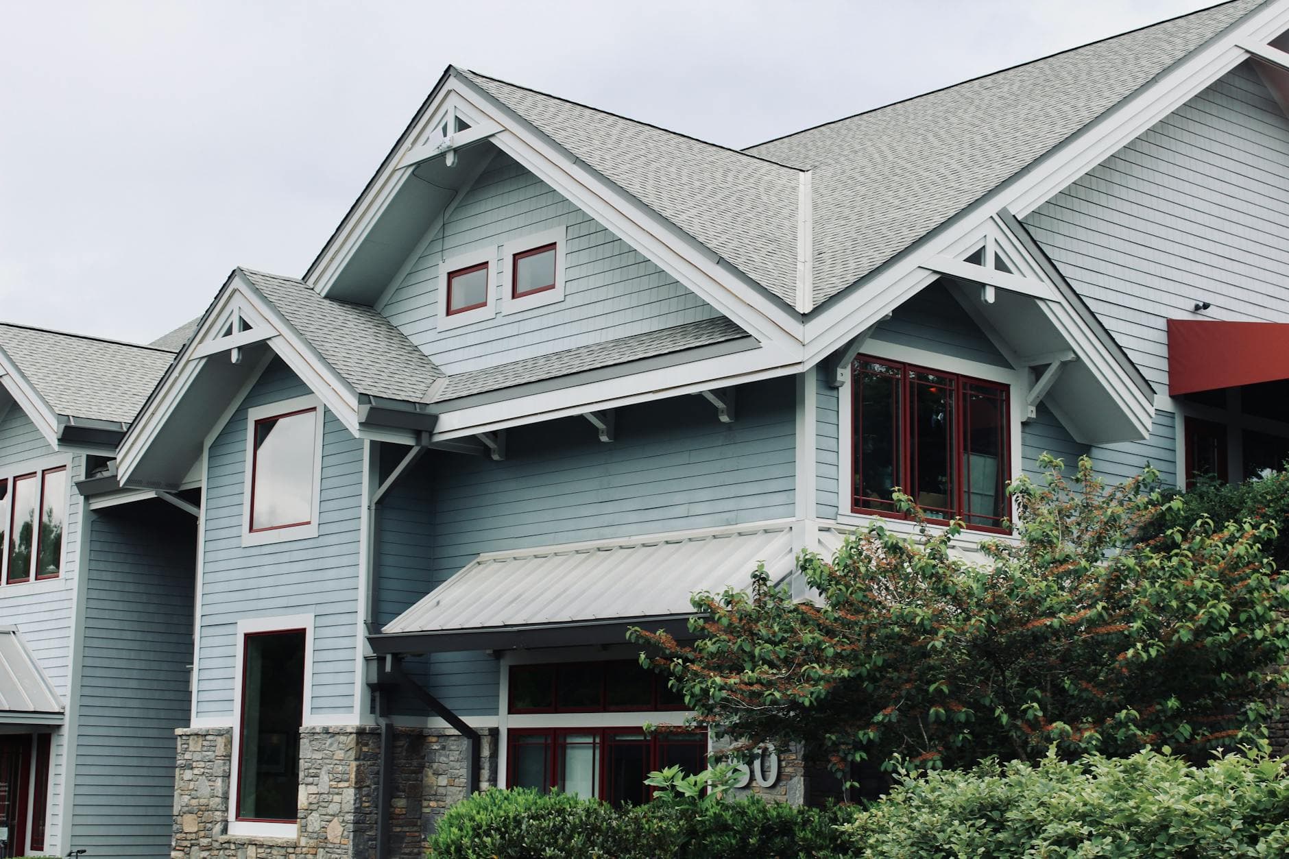 Different grades of asphalt roof shingles displayed side by side
